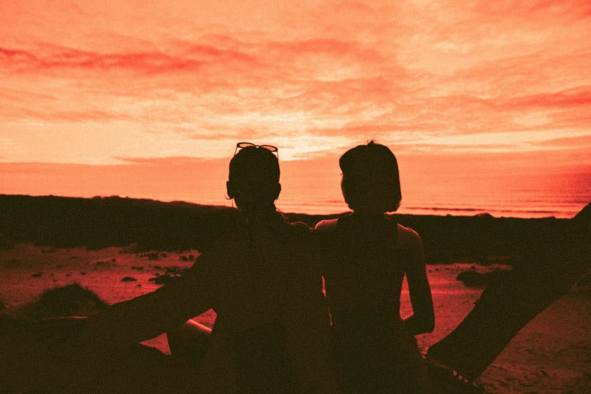 Girls watching the sunset from the cliffs